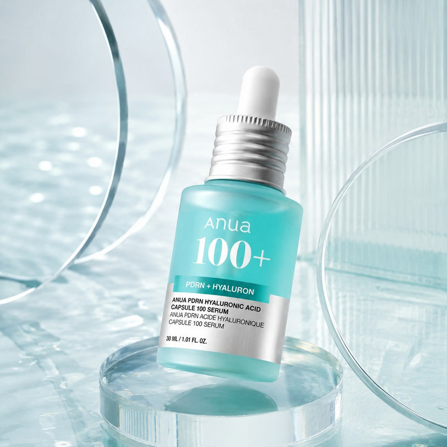 Kit Hidratante Anua PDRN: sérum Anua 100+ de 30 ml sobre cristal transparente