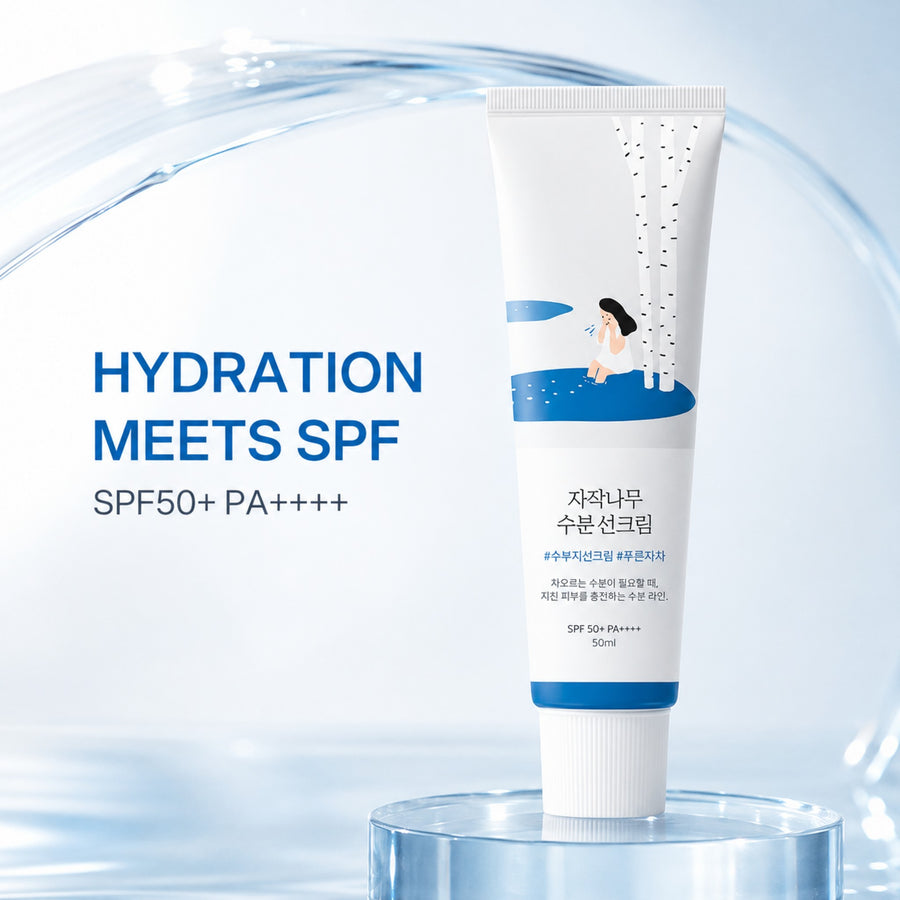 Kit Hidratación Round Lab: protector solar Birch Juice Sun Cream SPF50+ PA++++ sobre una burbuja de agua